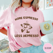 Comfort Colors tee in Blossom featuring retro style graphic of a happy coffee cup with text