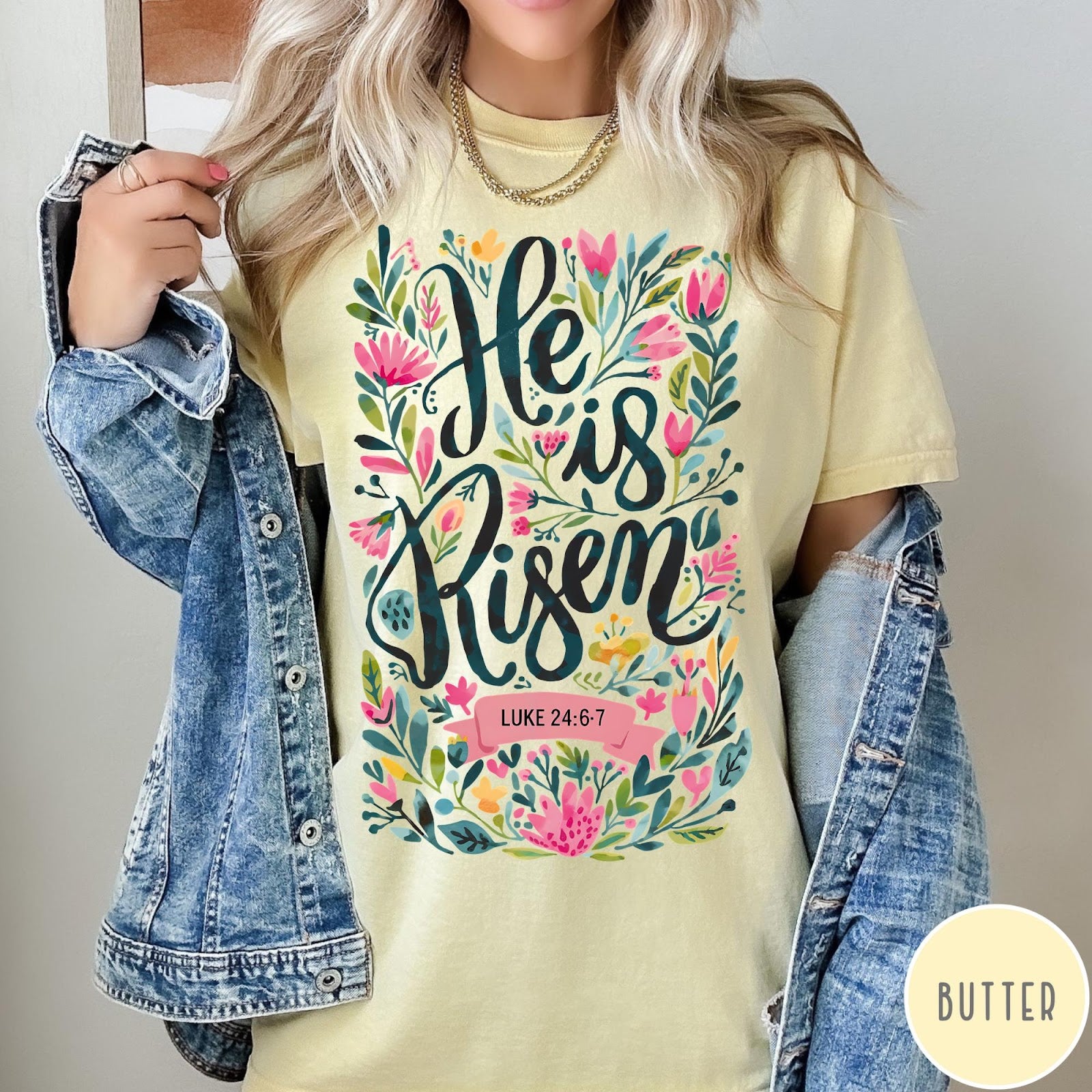 Comfort Colors tee in Butter featuring religious floral design with He is Risen text graphic
