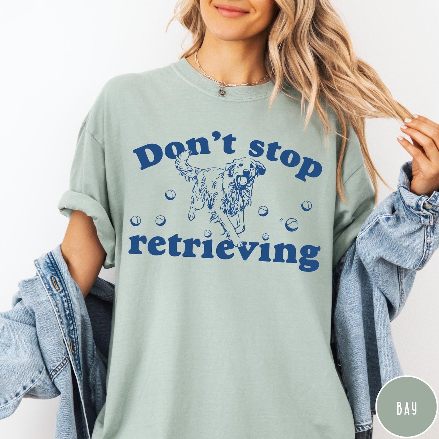 Comfort Colors tee in Bay featuring screen print style graphic of a Golden Retriever with tennis balls