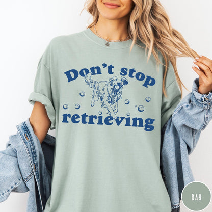 Comfort Colors tee in Bay featuring screen print style graphic of a Golden Retriever with tennis balls