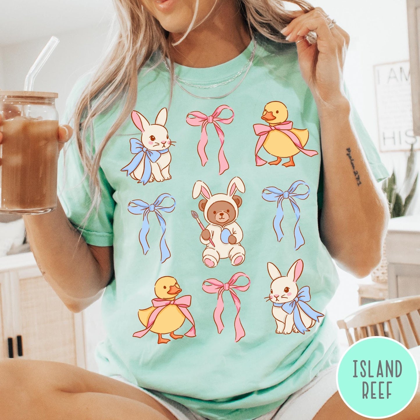 Comfort Colors tee in Island Reef featuring vintage style graphic with Easter bunnies, ducks, and pink blue bows