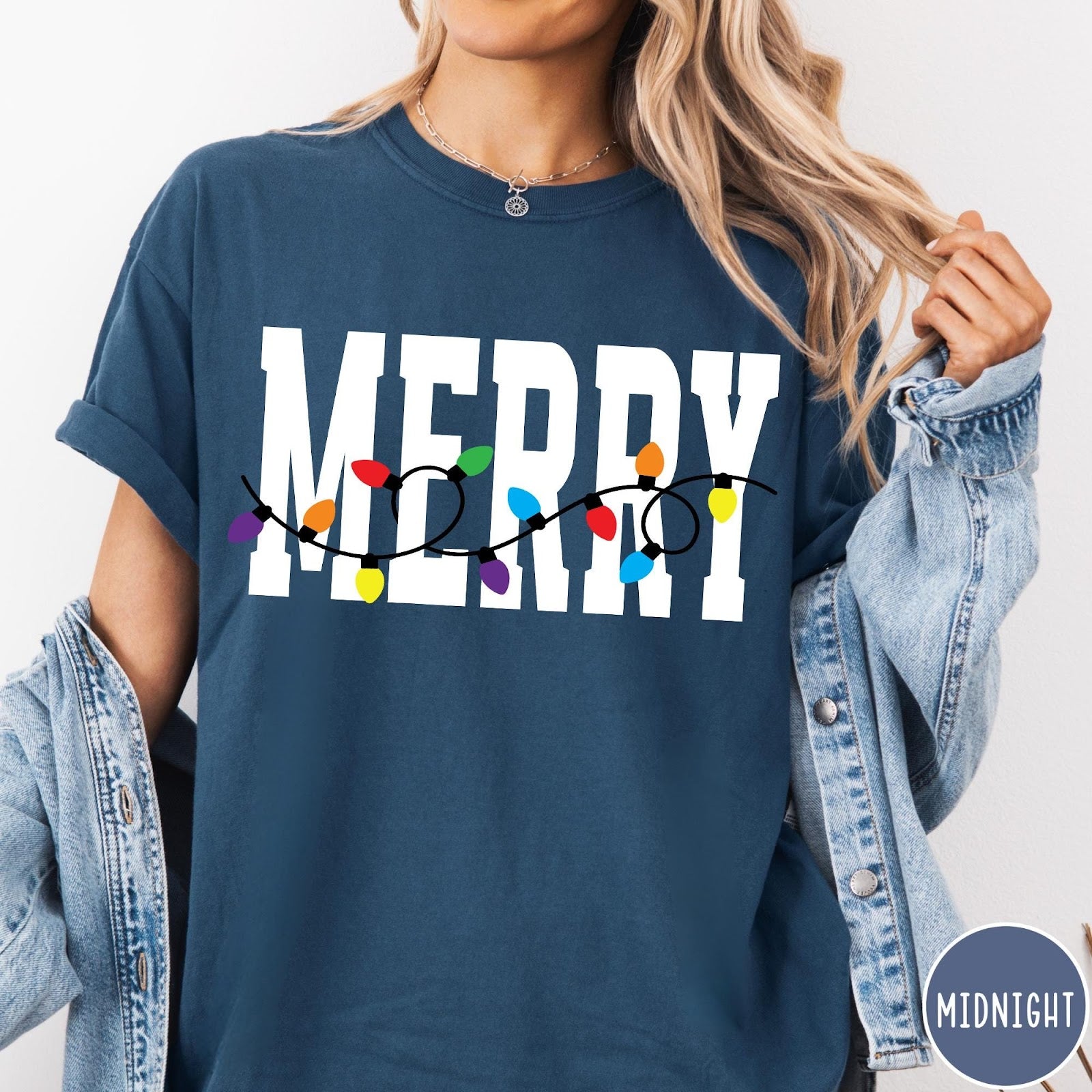 Comfort Colors tee in Midnight featuring festive holiday style graphic with Merry text and Christmas lights