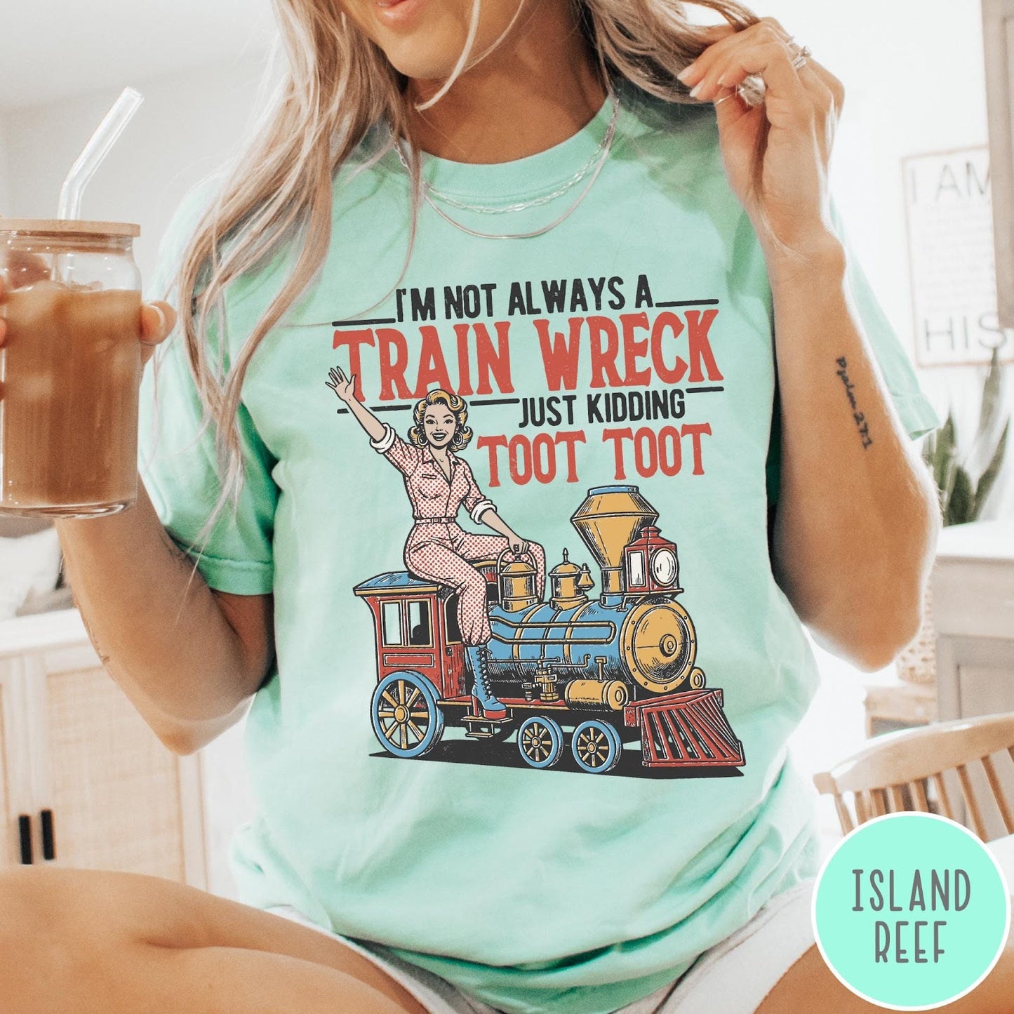 Comfort Colors tee in Island Reef featuring vintage pin-up style graphic of a woman riding a steam train