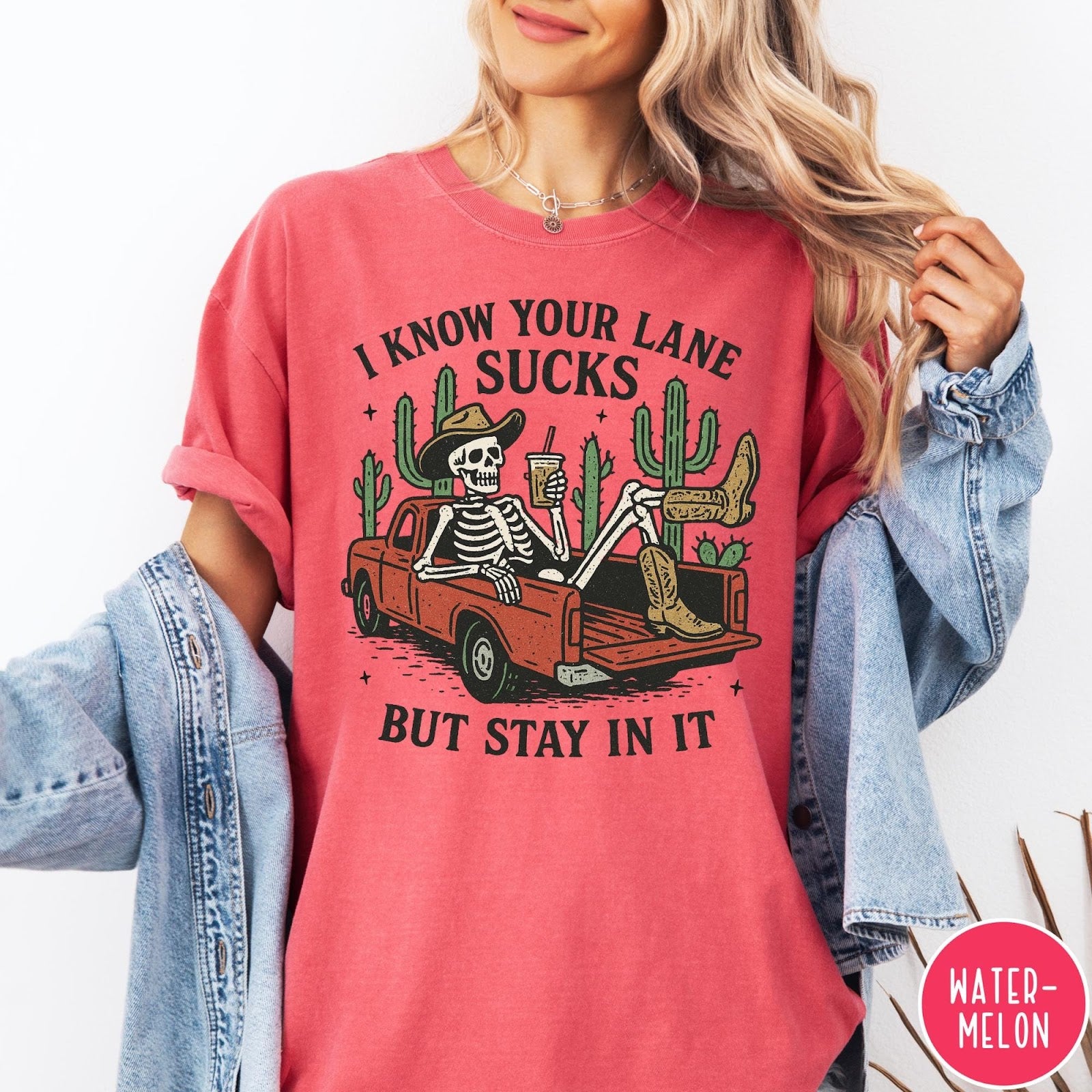 Comfort Colors tee in Watermelon featuring western skeleton design with cowboy hat and boots in truck bed