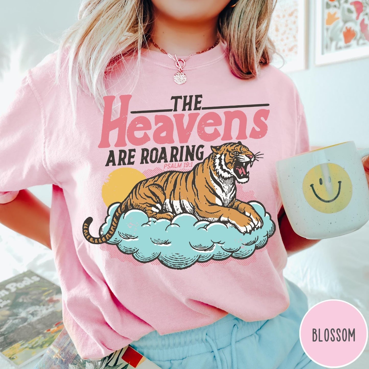 Comfort Colors tee in Blossom featuring retro graphic design of a roaring tiger resting on a cloud