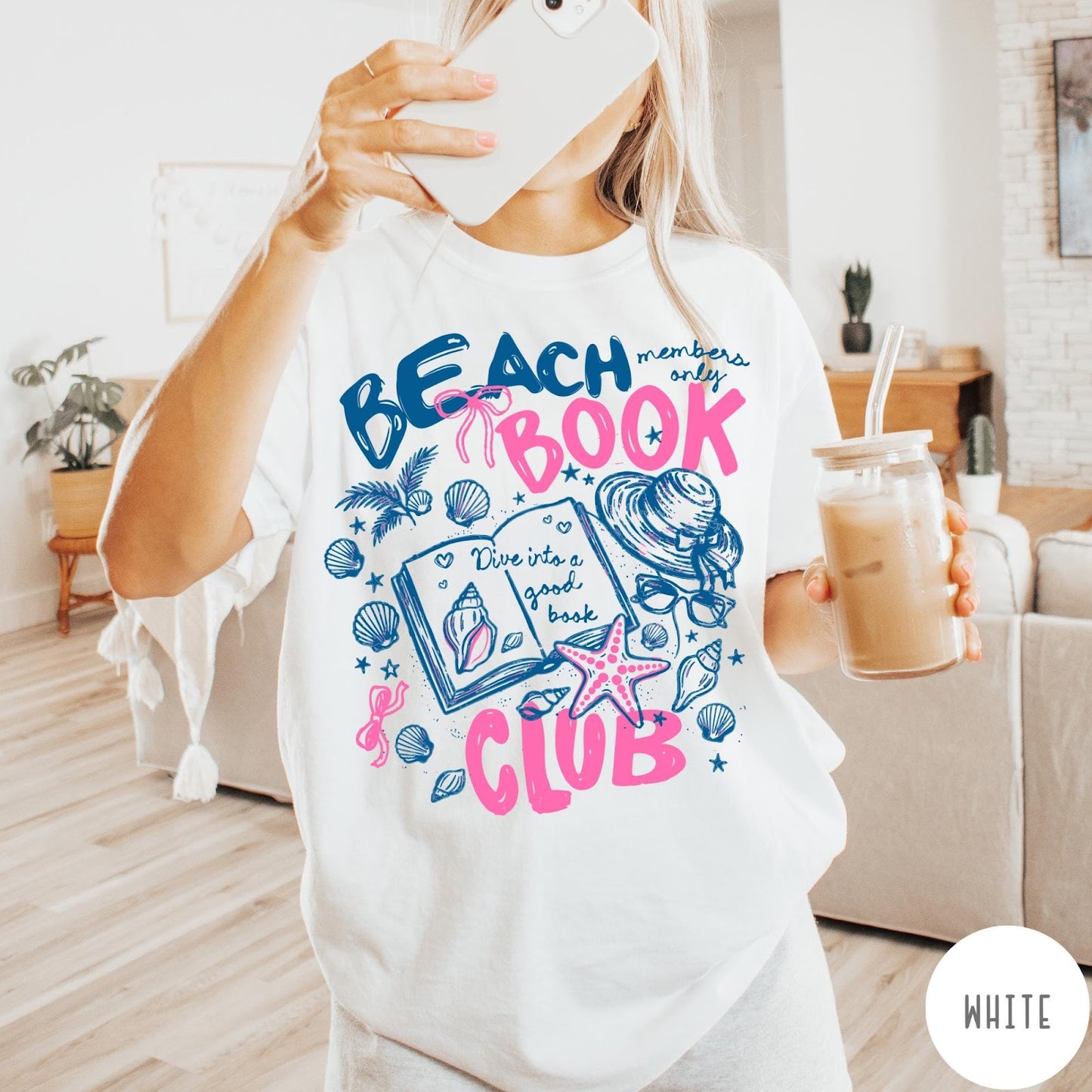 Comfort Colors tee in White featuring beach book club graphic with seashells, starfish, and a sun hat