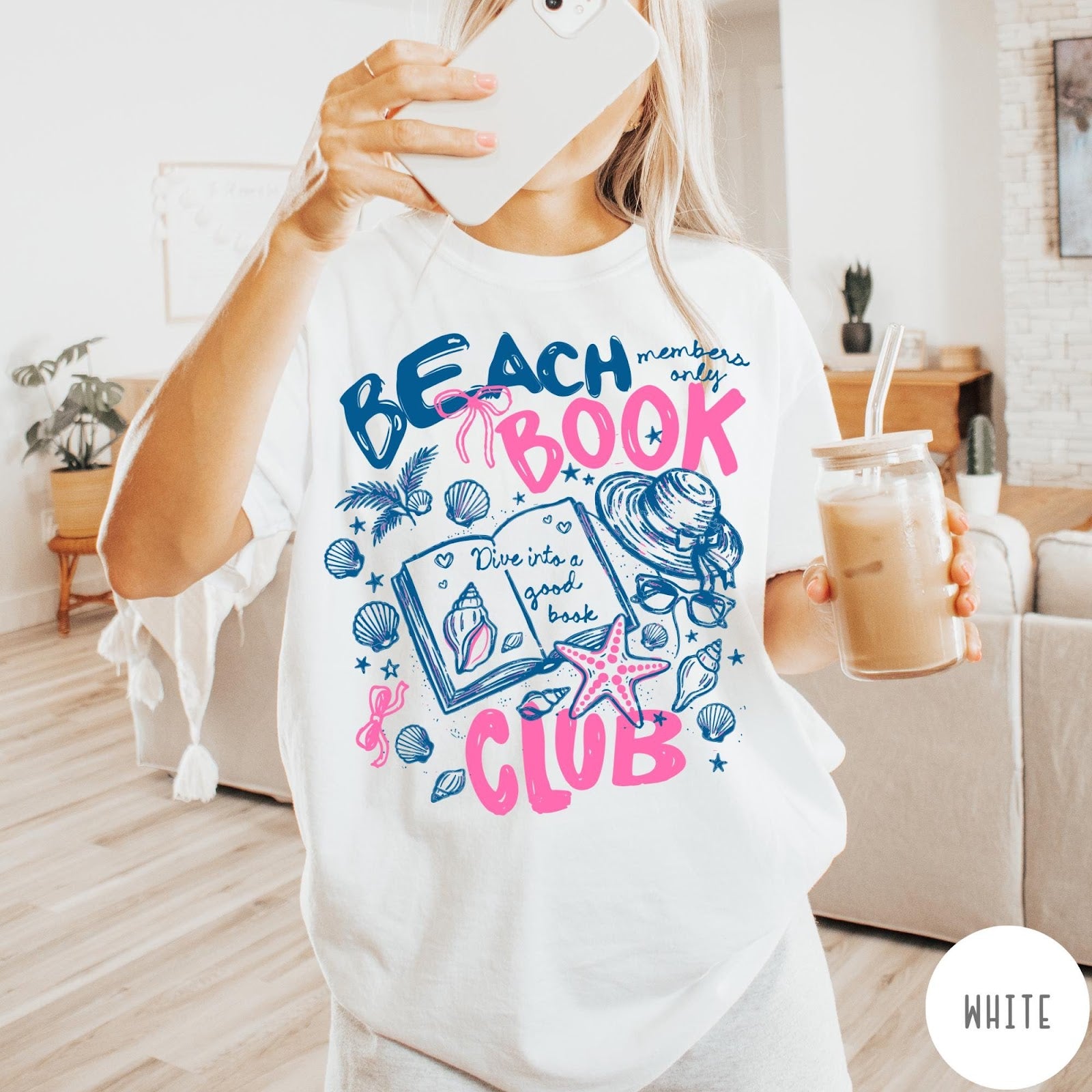Comfort Colors tee in White featuring beach book club graphic with seashells, starfish, and a sun hat