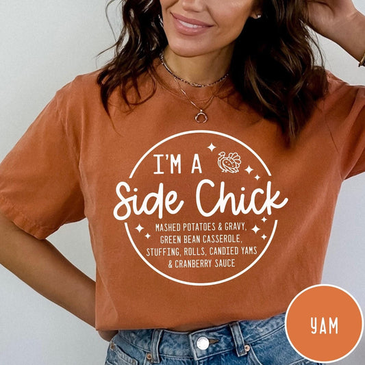 Comfort Colors tee in Burnt Orange featuring circular Thanksgiving side dish graphic with turkey and food list