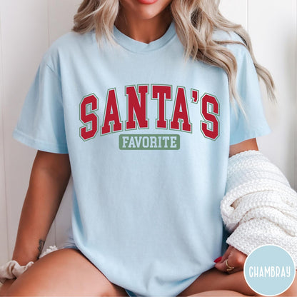 Comfort Colors tee in Chambray featuring collegiate style Santa's Favorite Christmas graphic with red and green text