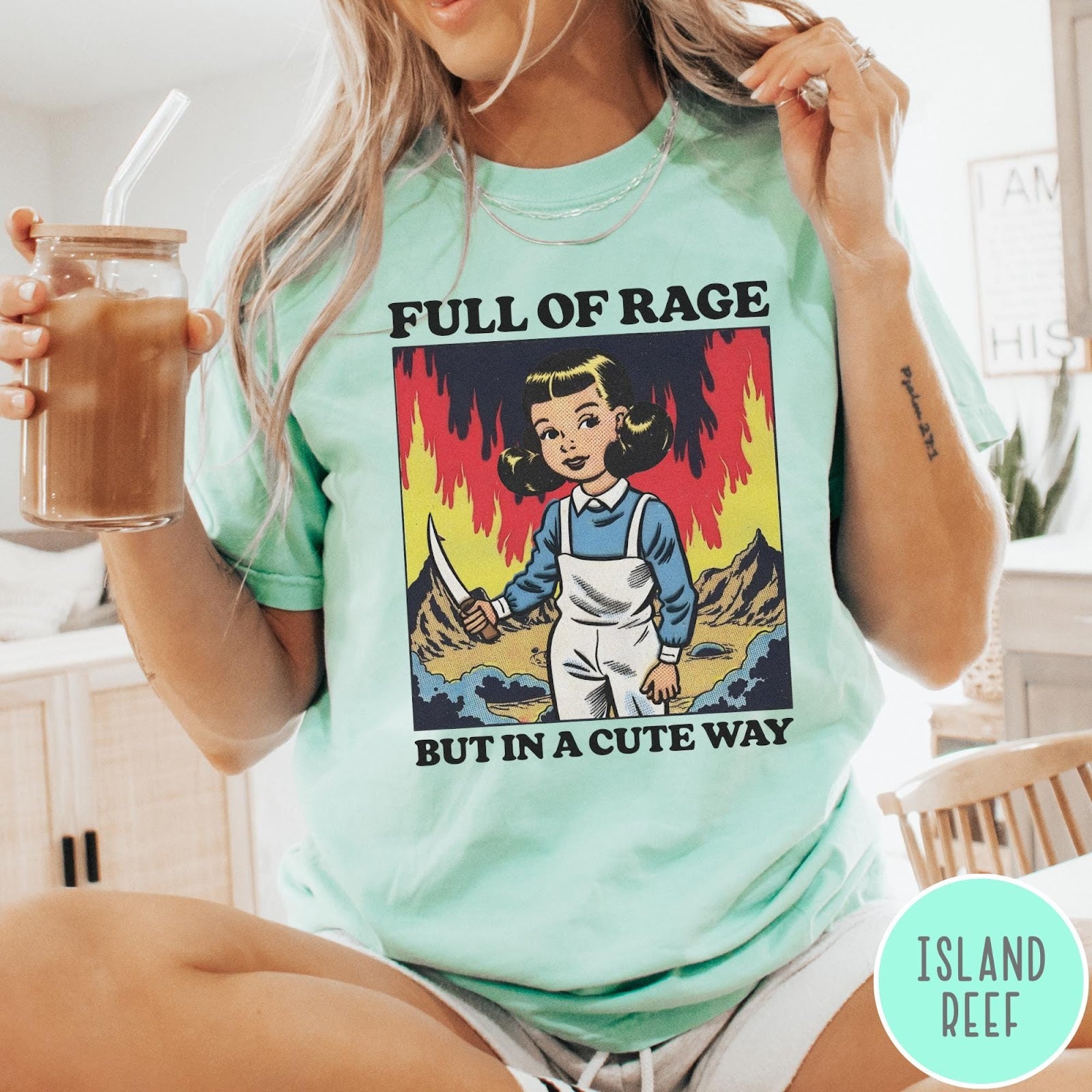 Comfort Colors tee in Island Reef featuring cartoon style graphic of a girl holding a knife in flames