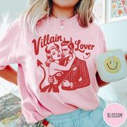 Comfort Colors tee in Blossom featuring vintage style graphic of a devilish couple embracing with red ink