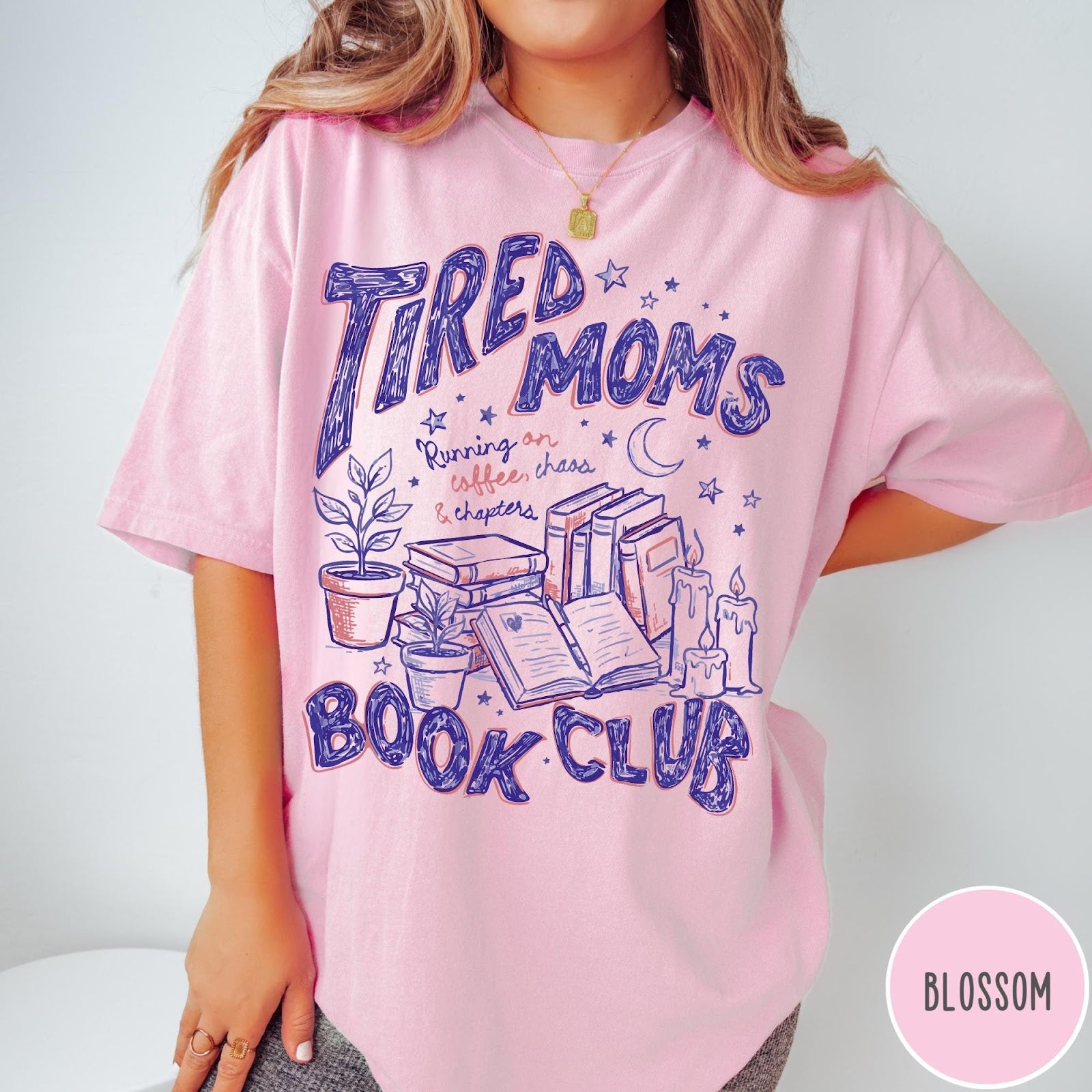 Comfort Colors tee in Blossom featuring illustrated book club graphic with plants, candles, and reading text