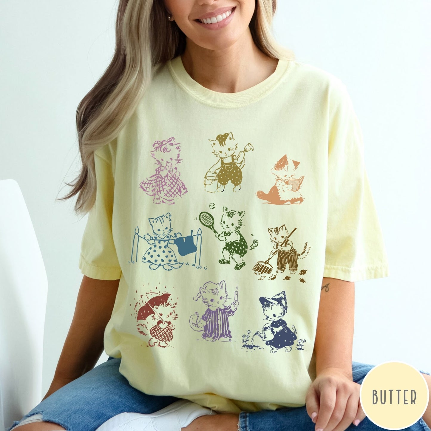 Comfort Colors tee in Butter featuring vintage retro style graphic of nine kittens doing various daily activities