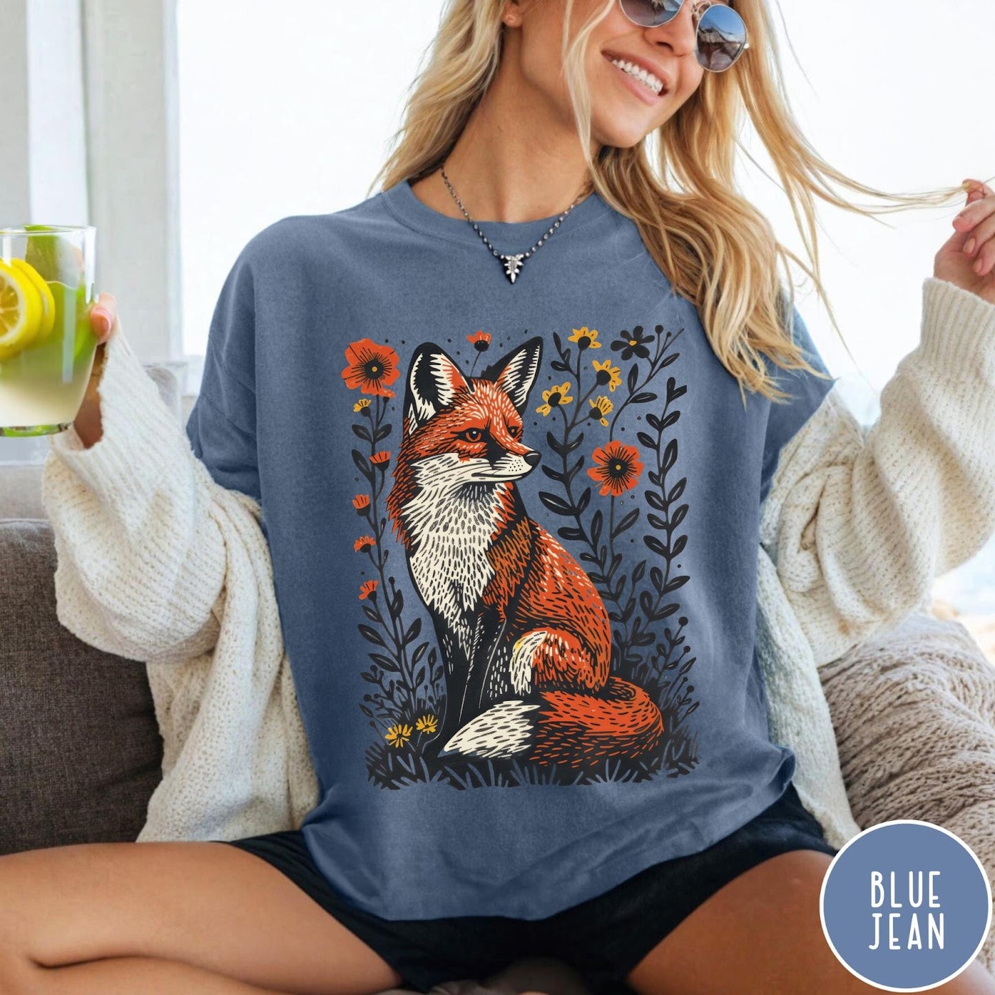 Comfort Colors tee in Blue Jean featuring vintage style graphic of a sitting fox surrounded by orange flowers