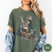 Comfort Colors tee in Moss featuring vintage style graphic of a deer family in a forest scene