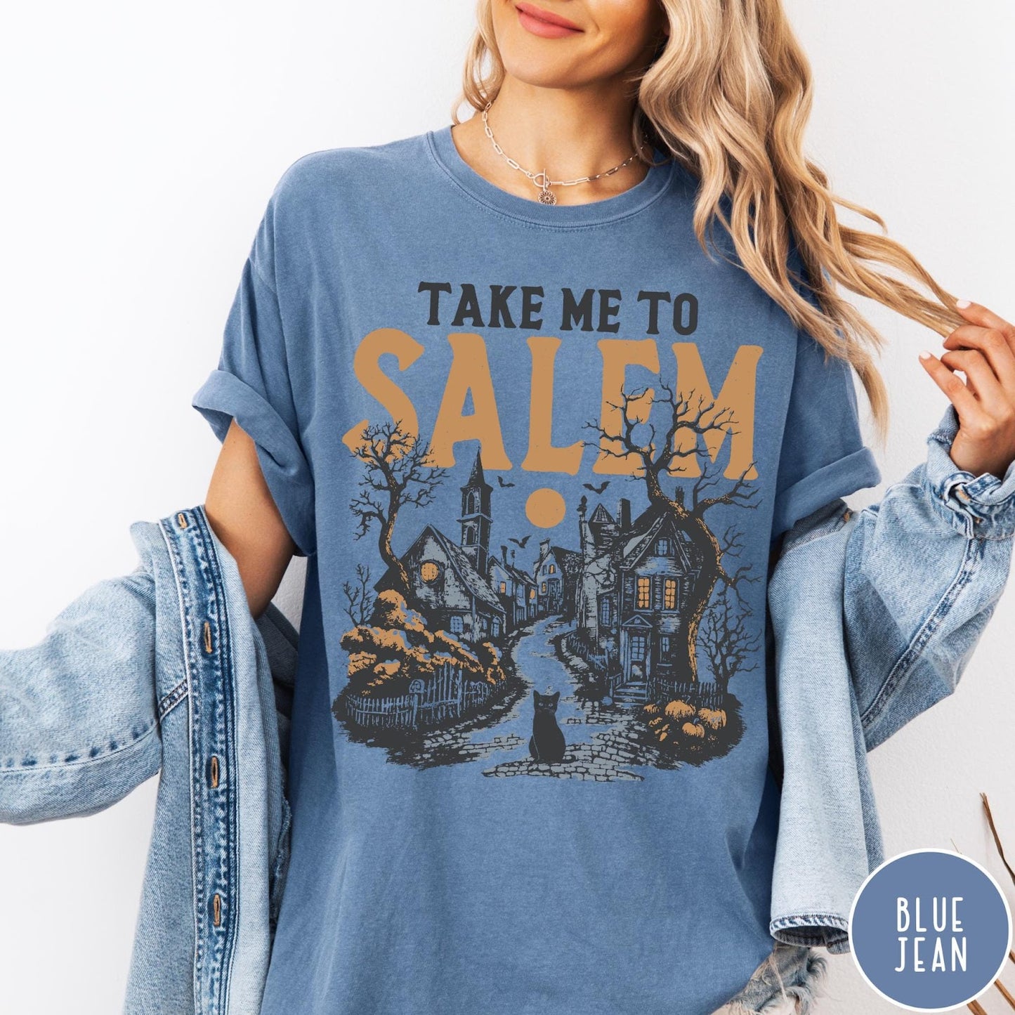 Comfort Colors tee in Blue Jean featuring vintage style Salem town scene with black cat and pumpkins
