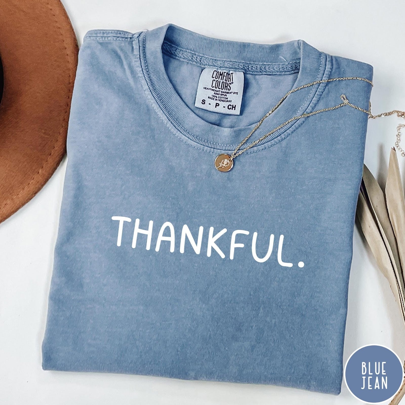 Comfort Colors tee in Blue Jean featuring minimalist style with the word Thankful printed in white text