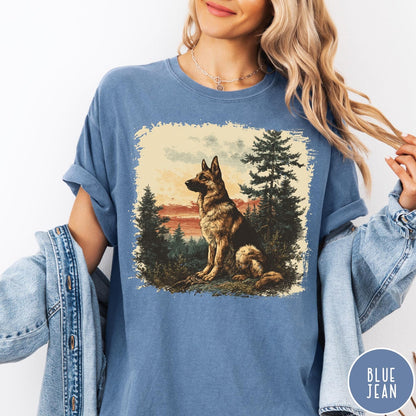 Comfort Colors tee in Blue Jean featuring vintage style graphic of a German Shepherd sitting in a forest