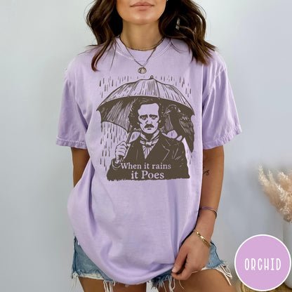 Comfort Colors tee in Orchid featuring graphic illustration of Edgar Allan Poe with umbrella and raven
