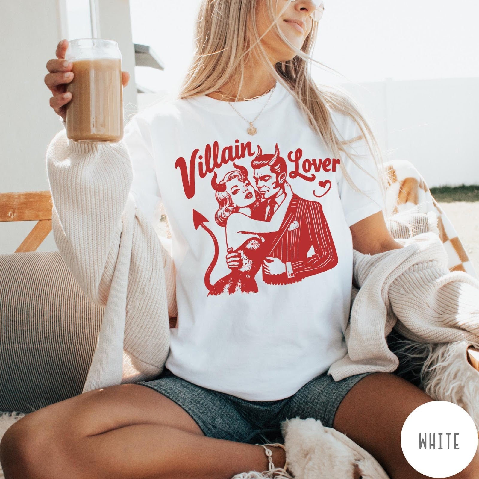 Comfort Colors tee in White featuring vintage style graphic of a devilish couple embracing with red ink