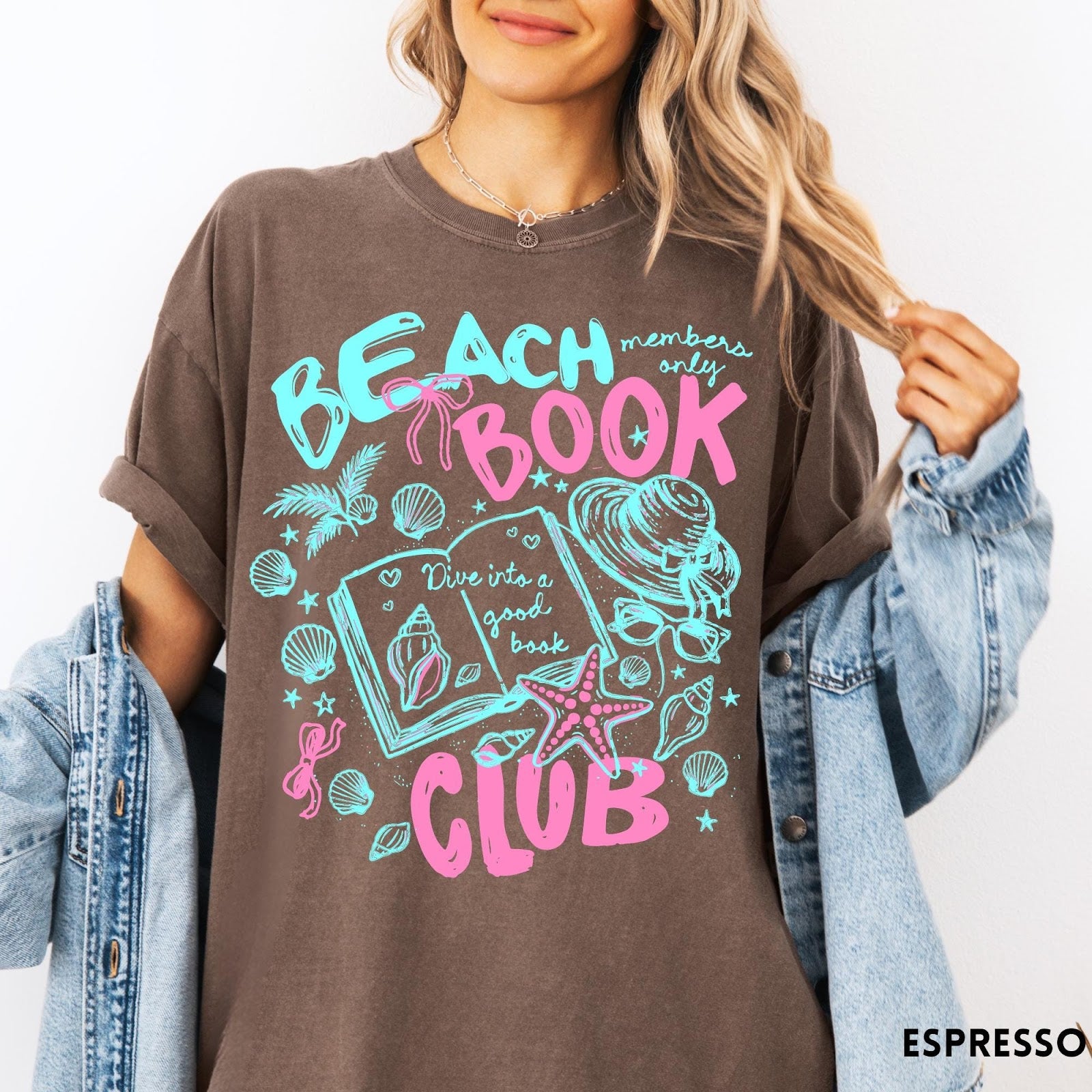 Comfort Colors tee in Espresso featuring beach book club graphic with open book, shells, and hat