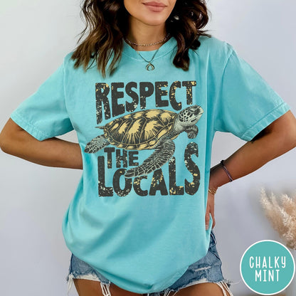 Comfort Colors tee in Chalky Mint featuring vintage style sea turtle graphic with Respect the Locals text
