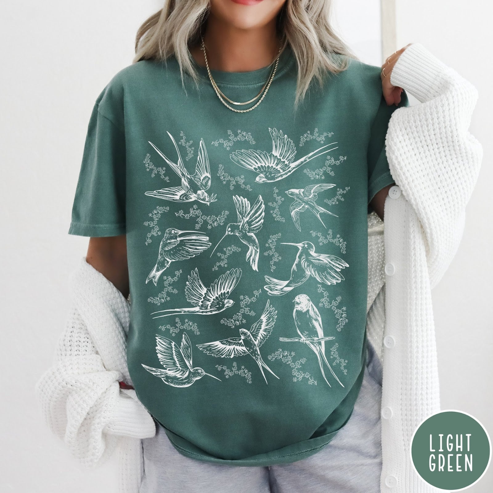 Comfort Colors tee in Light Green featuring vintage bird tattoo style graphic with various birds and flowers