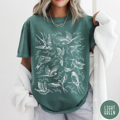 Comfort Colors tee in Light Green featuring vintage bird tattoo style graphic with various birds and flowers