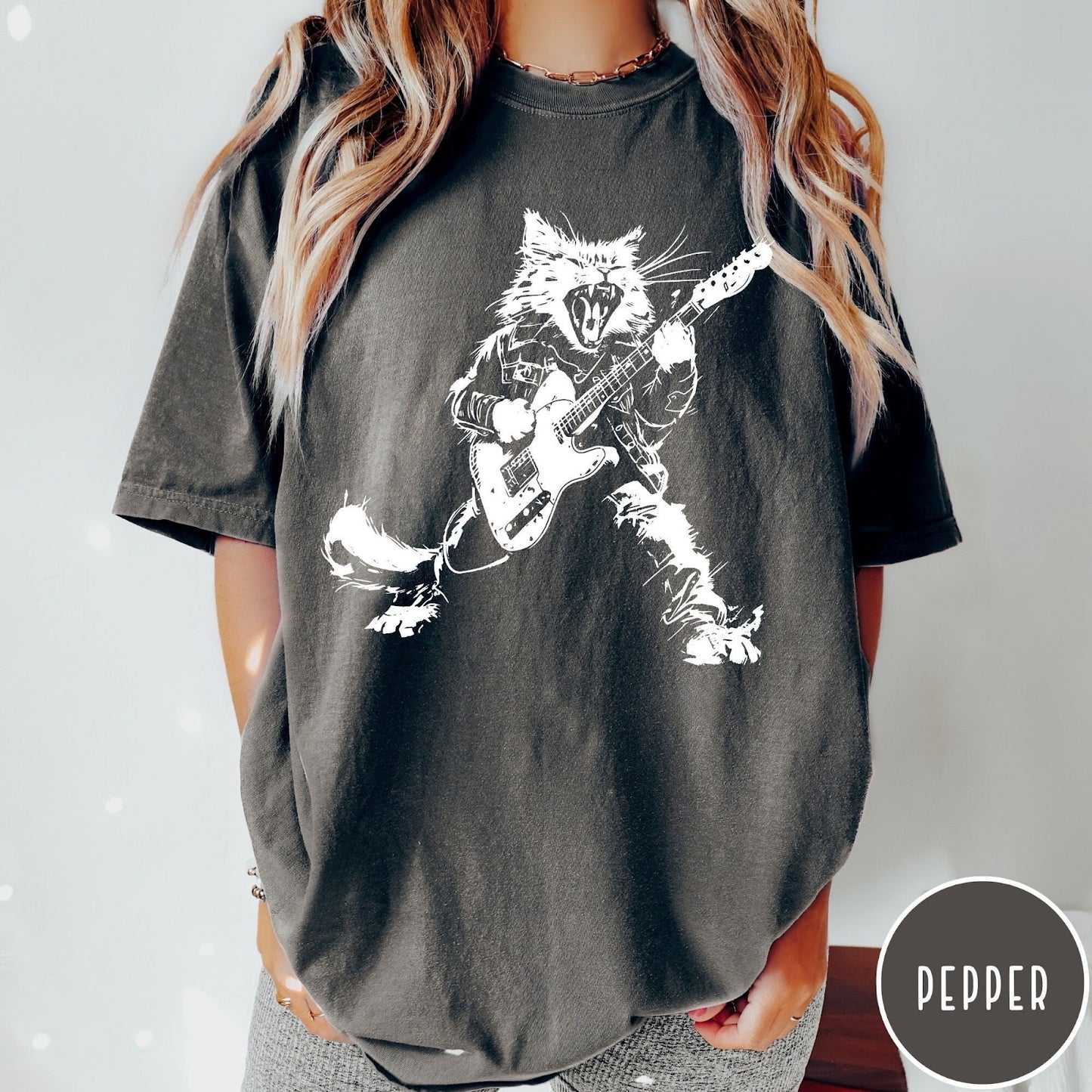 Comfort Colors tee in Pepper featuring rock music style graphic of a cat playing an electric guitar