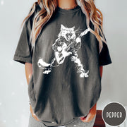 Comfort Colors tee in Pepper featuring rock music style graphic of a cat playing an electric guitar