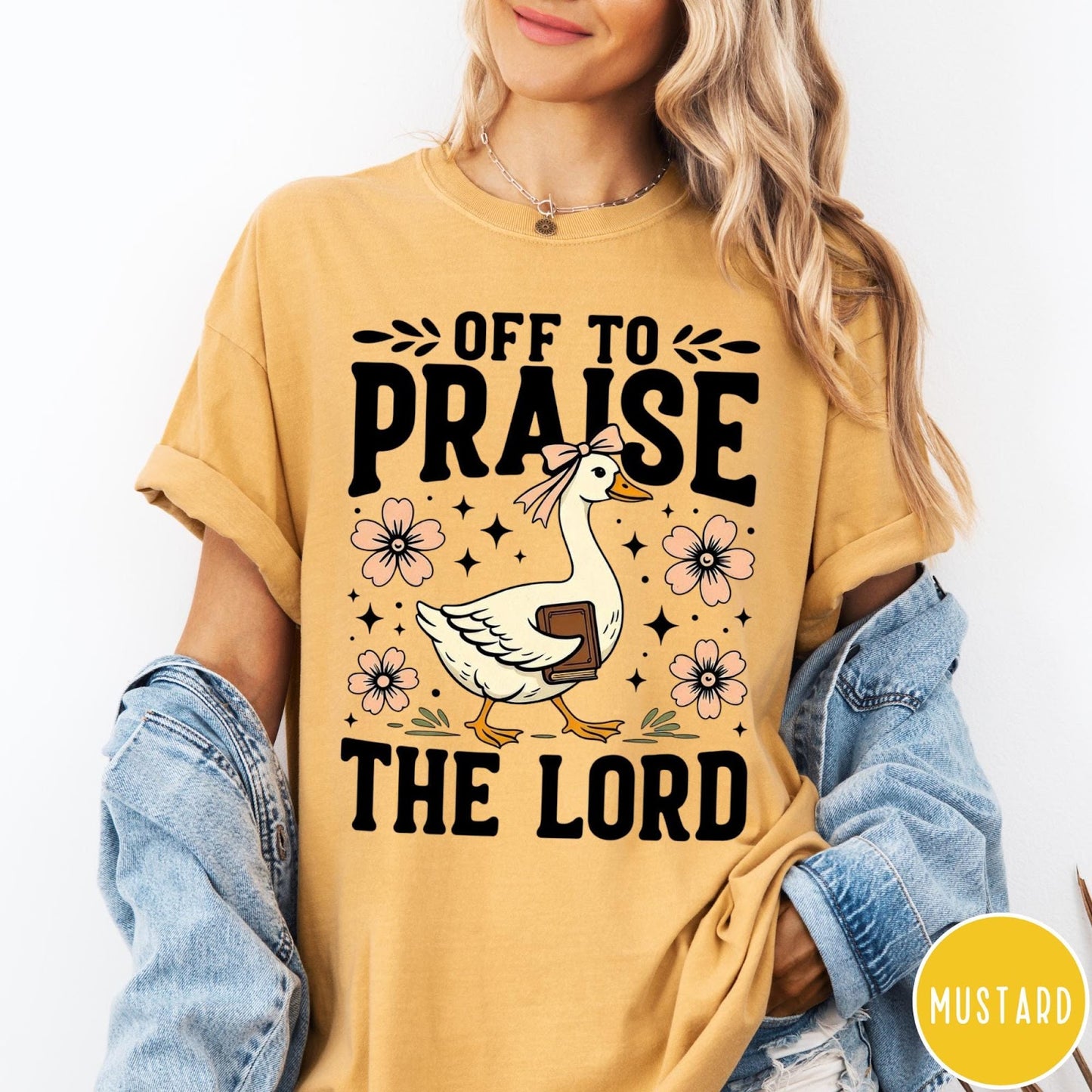 Comfort Colors tee in Mustard featuring screen print style graphic of a goose carrying a book