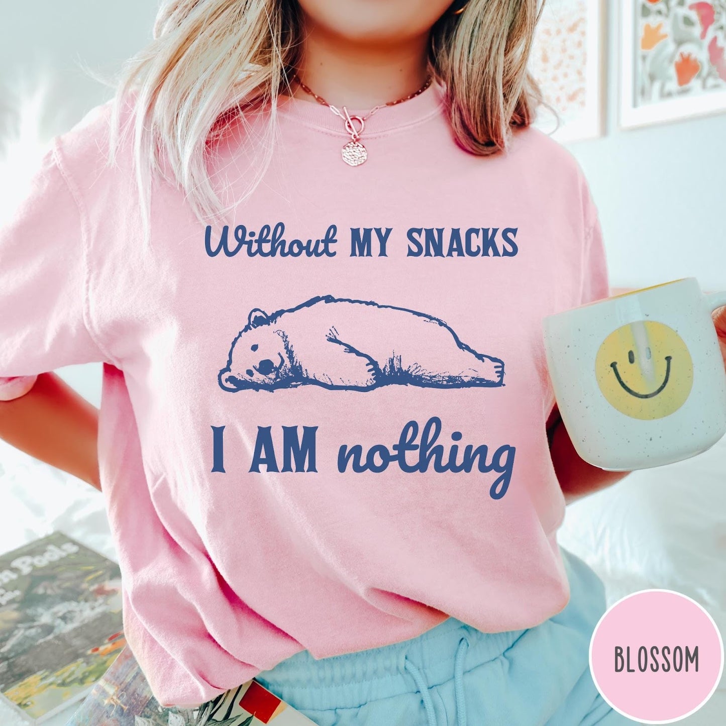 Comfort Colors tee in Blossom featuring illustrated bear graphic with text Without My Snacks I Am Nothing