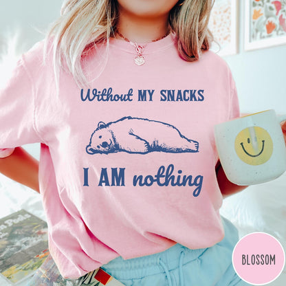Comfort Colors tee in Blossom featuring illustrated bear graphic with text Without My Snacks I Am Nothing