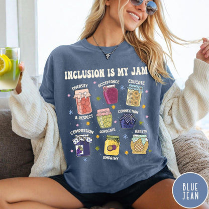 Comfort Colors tee in Blue Jean featuring retro style graphic with jam jars labeled with inclusion and advocacy terms