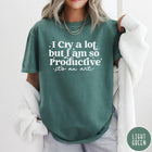 Comfort Colors tee in Light Green featuring mental health humor graphic text I Cry but Productive