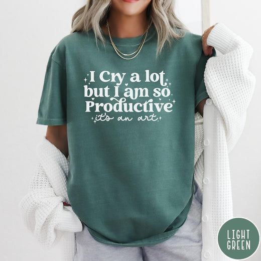 Comfort Colors tee in Light Green featuring mental health humor graphic text I Cry but Productive