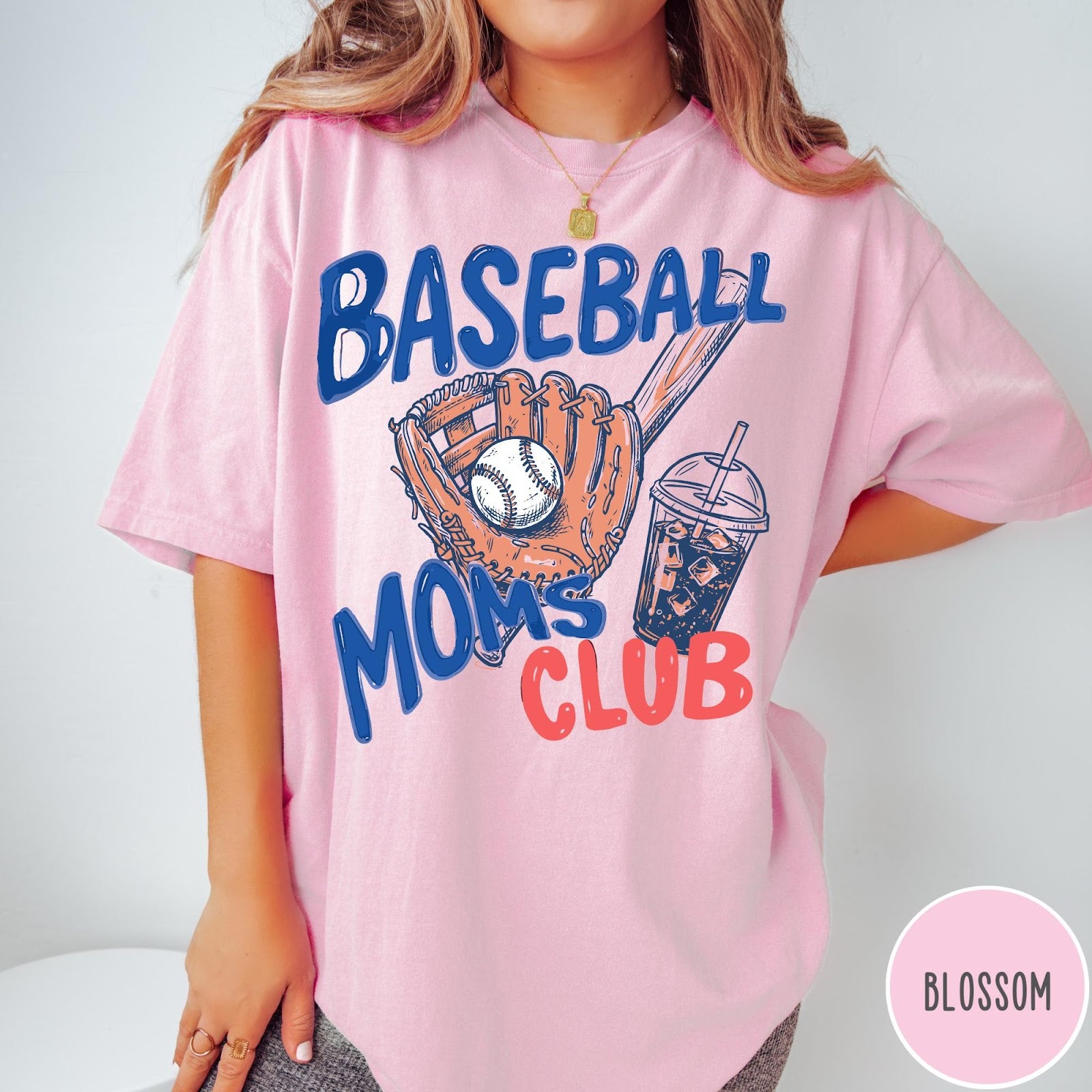 Comfort Colors tee in Blossom featuring baseball mom graphic with glove, ball, bat, and iced coffee