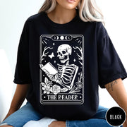 Comfort Colors tee in Black featuring tarot card style graphic of a skeleton reading a book