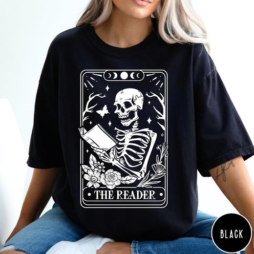 Comfort Colors tee in Black featuring tarot card style graphic of a skeleton reading a book