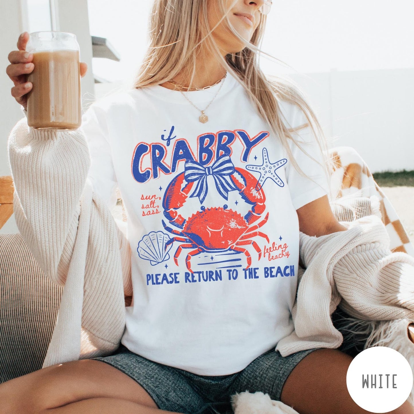 Comfort Colors tee in White featuring beachy crab graphic with bow, starfish, seashell, and coastal text