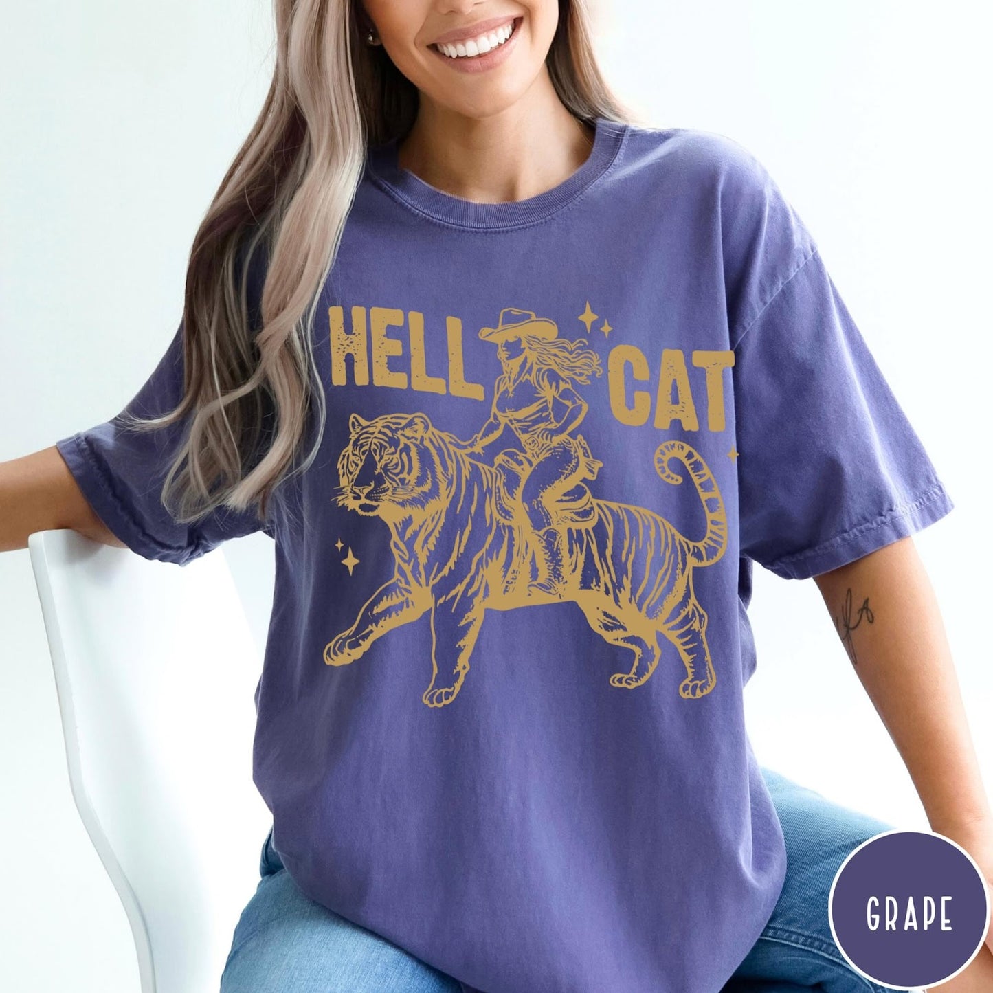 Comfort Colors tee in Grape featuring western style graphic of a cowgirl riding a large tiger
