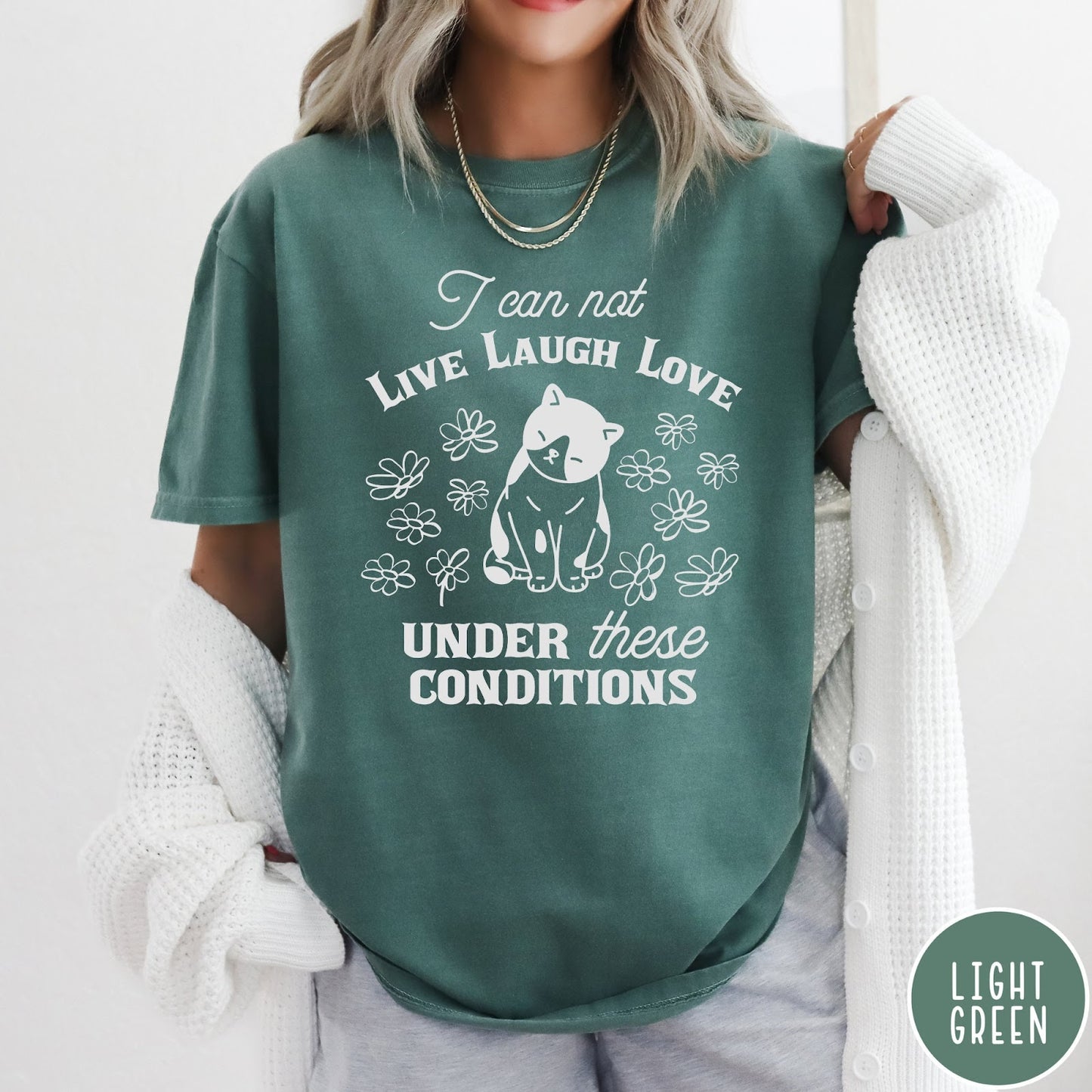 Comfort Colors tee in Light Green featuring whimsical graphic style with a cat and flowers and text.