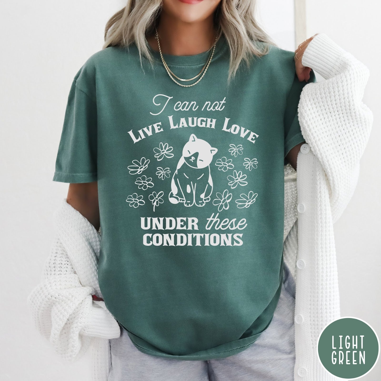 Comfort Colors tee in Light Green featuring whimsical graphic style with a cat and flowers and text.