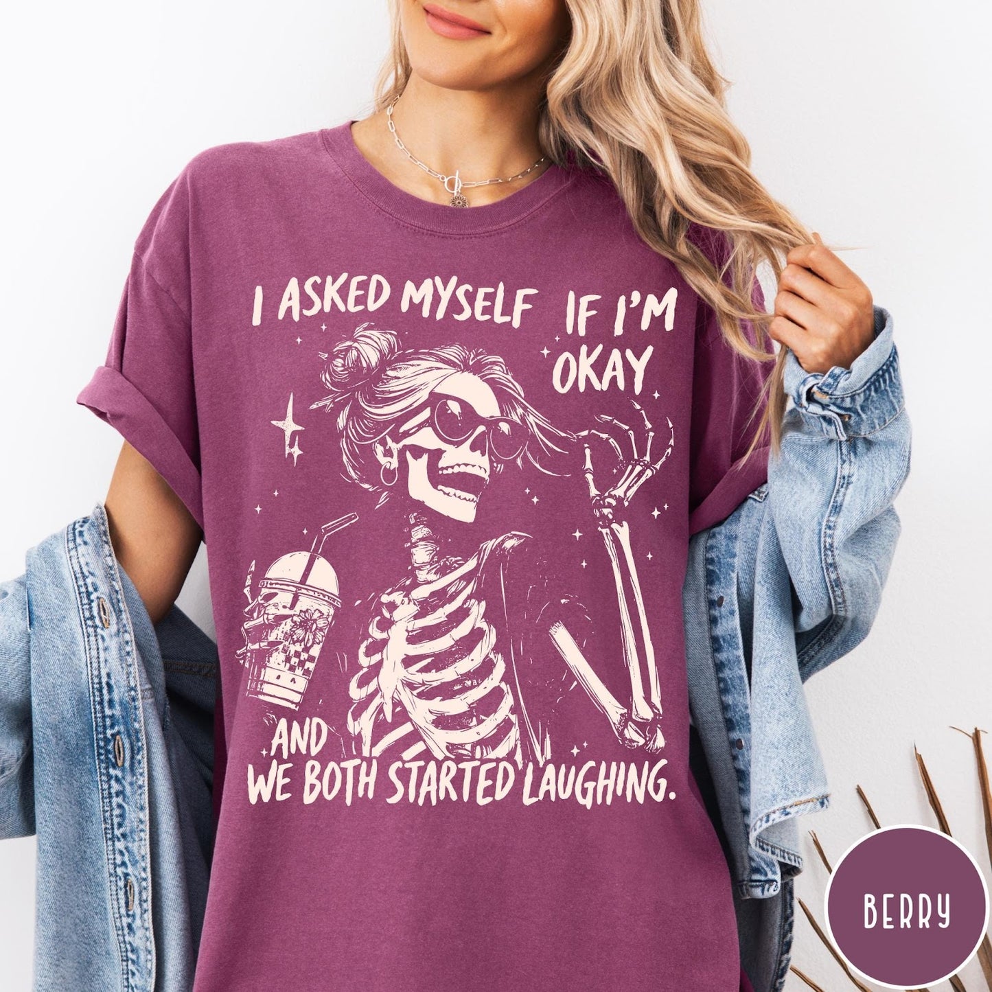 Comfort Colors tee in Berry featuring skeleton design with sunglasses and iced coffee with laughing text graphic