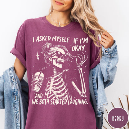 Comfort Colors tee in Berry featuring skeleton design with sunglasses and iced coffee with laughing text graphic