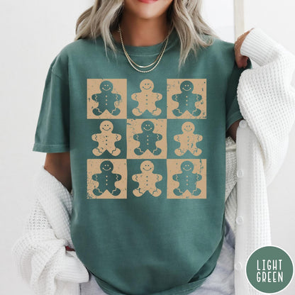 Comfort Colors tee in light green featuring grid style graphic with alternating tan and green gingerbread cookie patterns