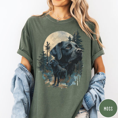 Comfort Colors tee in Moss featuring nature style graphic of black Labrador dogs in a forest moon scene