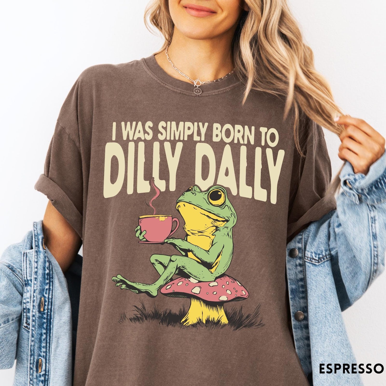Comfort Colors tee in Espresso featuring illustrative style graphic of a frog sitting on a mushroom drinking tea