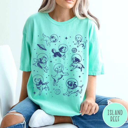 Comfort Colors tee in Island Reef featuring space theme graphic with various dogs wearing astronaut helmets and planets