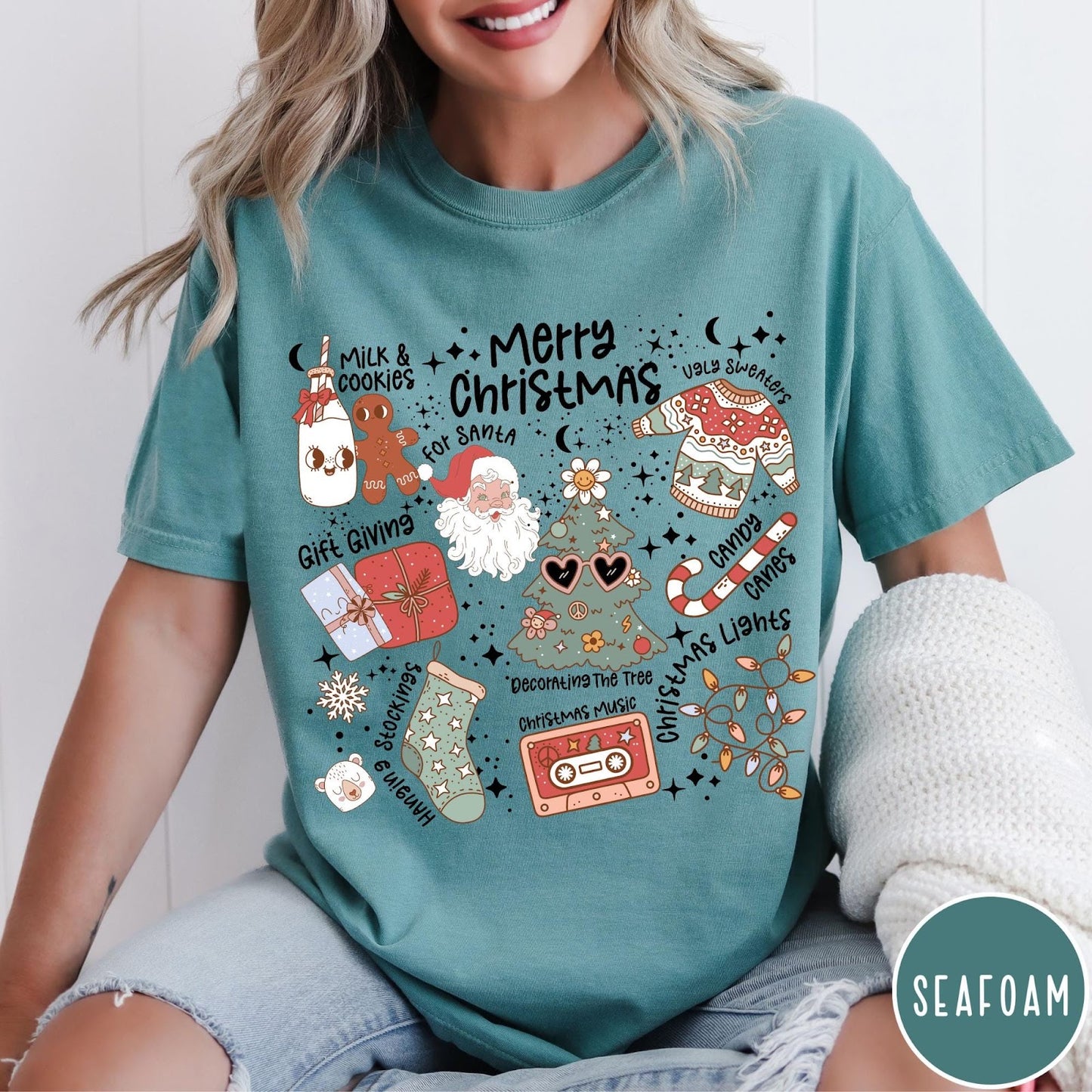 Comfort Colors tee in Seafoam featuring retro holiday graphic with Santa, Christmas tree, and festive icons